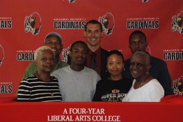 Askia with his family from New Orleans and Coach Robbins on his signing day.